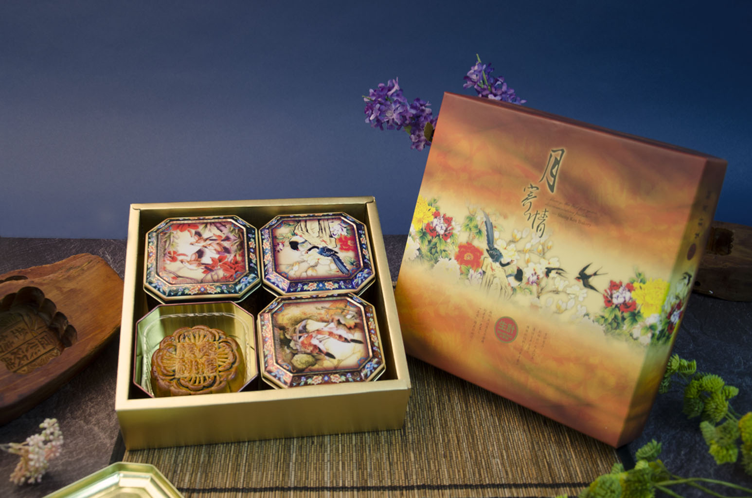 A box of 4 Large Mooncakes, each in a unique patterned metal tin.