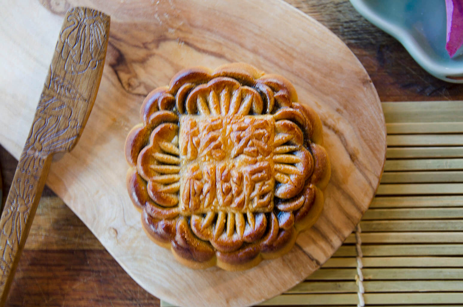 Large Walnut & Date Mooncake on wooden plate