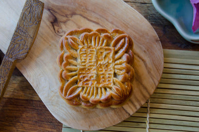 Large Lotus & Yolk Mooncake on wooden plate