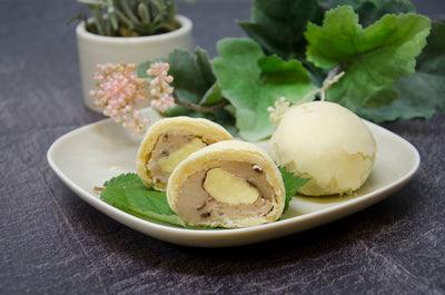 Luna Pastry cut to see cross-section on white plate