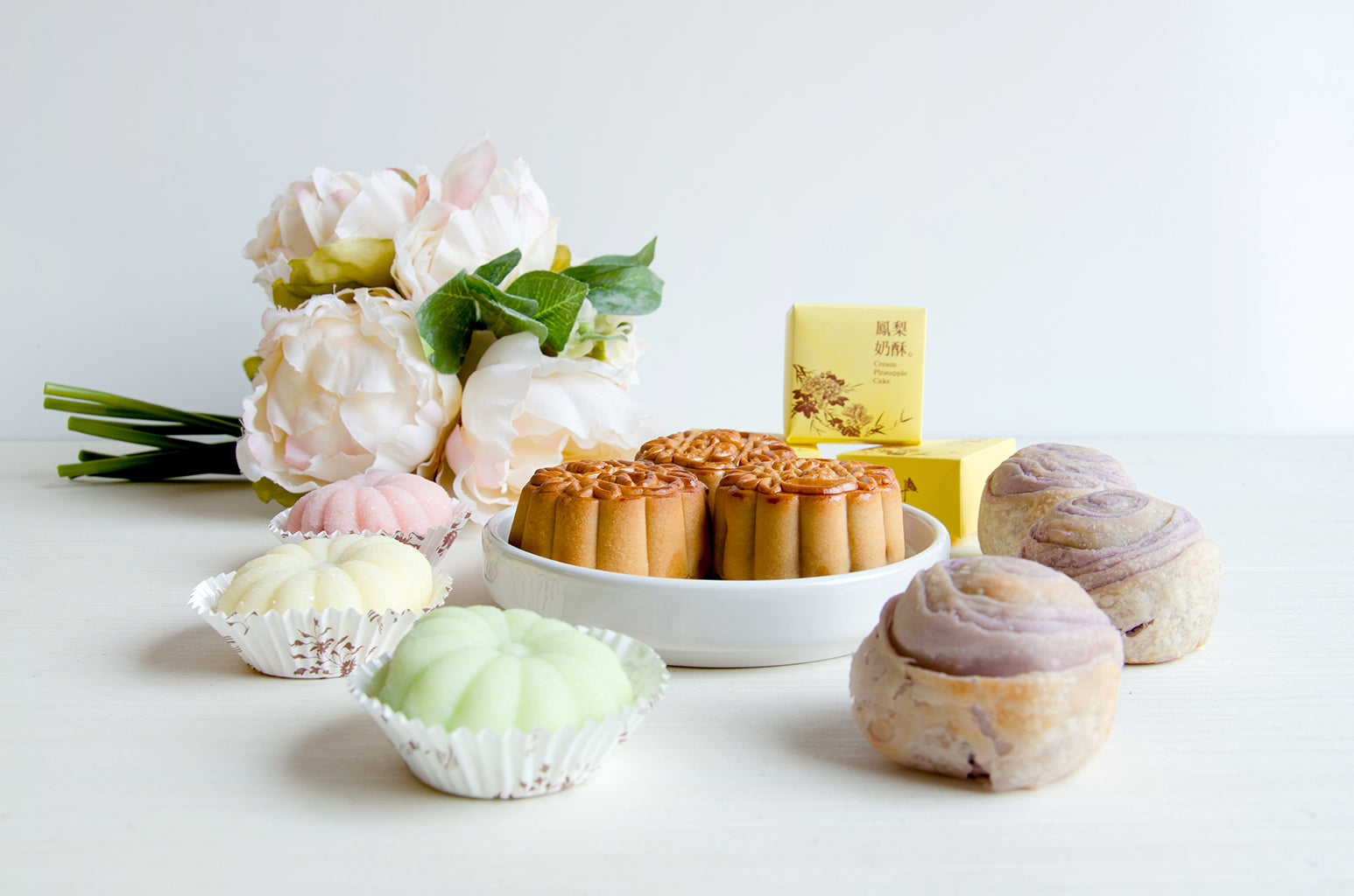 Small Date, Lotus, Red Bean Mooncakes. 3 Pineapple Pastries. 3 Taro Mochi Pastries. Fruit Mooncakes (Strawberry, Mango, Honeydew)